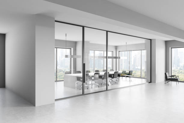 istock Modern open-space office interior with large windows, cityscape view, and rows of desks and chairs. 3D Rendering 2199928546