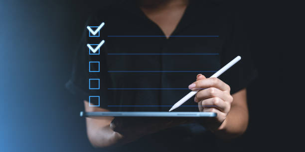 istock Digital checklist being marked on a tablet with a stylus pen. 2199929072