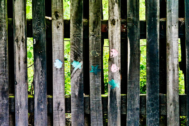 istock Rustic wooden brown vegetable garden fence 2199929549