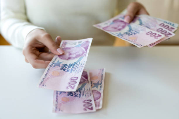 istock Unrecognizable female counting money 2199931330