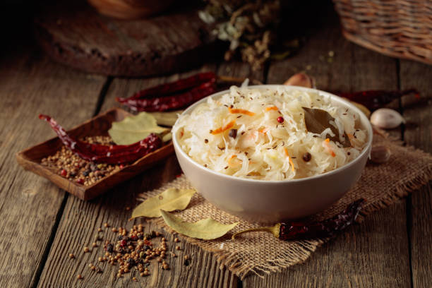 istock Traditional German sauerkraut on a old rustic wooden table. 2199932914