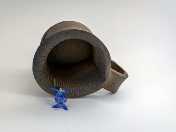 picture with decorative clay mug, blue floral accent, handmade, ceramics, mug on a light background, pottery