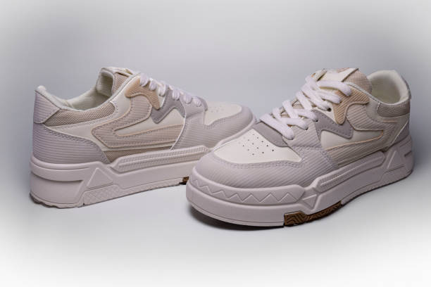 istock Pair of stylish beige sneakers on white background 2199935762