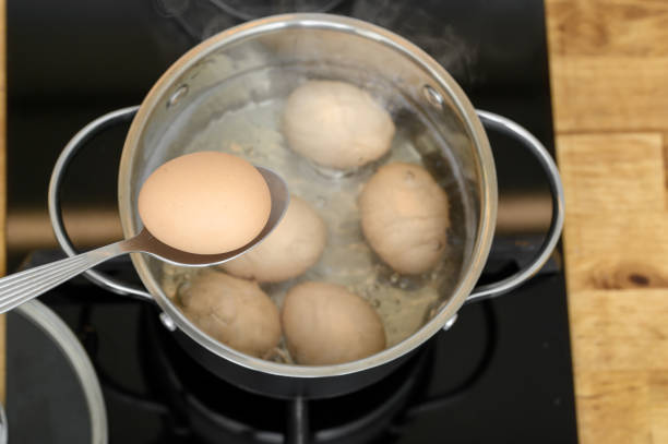 istock Hard-boiled chicken eggs in a steel pot 2199939277