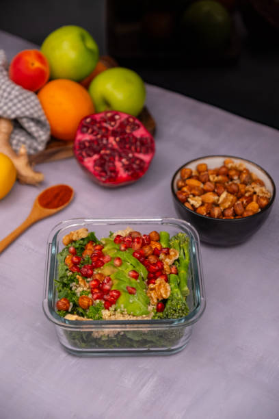 istock Superfood salad with kale, avocado, quinoa, broccoli, pomegranate and nuts 2199945663