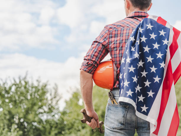 istock Attractive man and American Flag. Labor and employment concept 2199946220