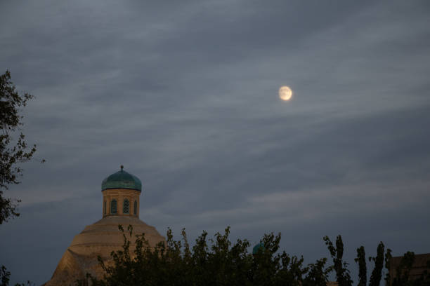 istock Bukhara, Uzbekistan - October 15, 2024: sky with moon and dome 2199953247