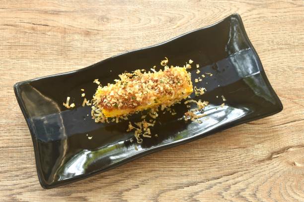 istock grilled Tamakoyaki or Japanese sweet egg roll omelet topping dry fish 2199954794