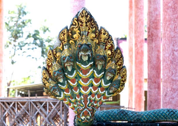 Shot in color detail on the facade of this historic building representing some character, animal or flower. Set at Siem Riep, Angkor Wat , Cambodia, Asia