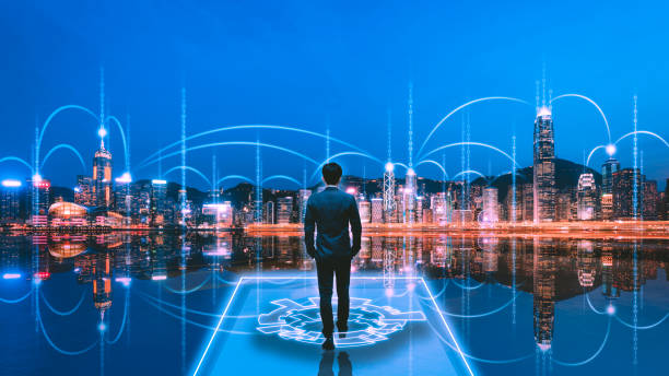 istock Professional business man on future technology network iot smart city background at night in Victoria Harbour Hong Kong 2199959210