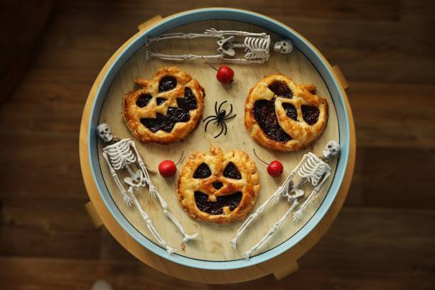 istock Halloween baked goods with jack pumpkin faces 2199959502