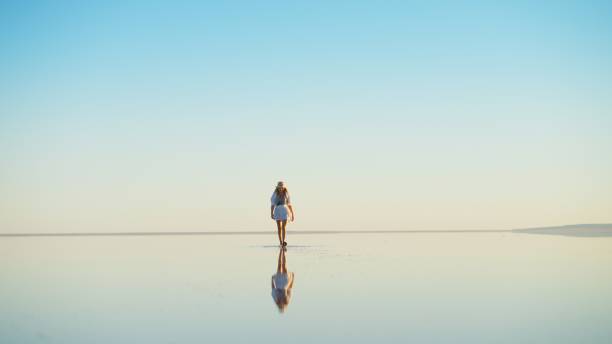 istock Tourist Walking Towards Camera at Salt Lake, Turkey 2199959886