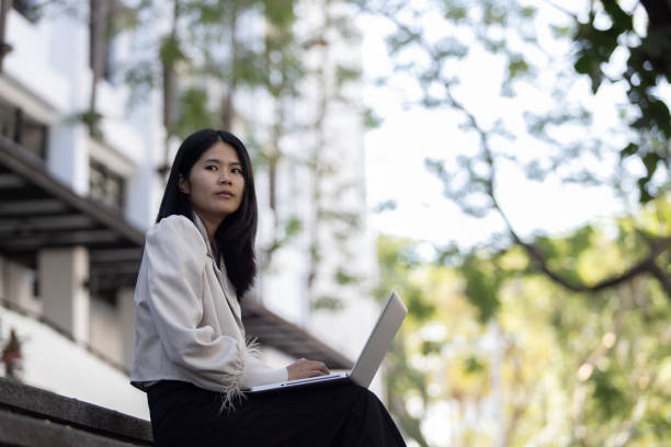 istock Future remote work combines technology smart phone connection online white digital business woman enable e-learning productivity while travel blend comfort modern devices serenity computer equipment 2199963709