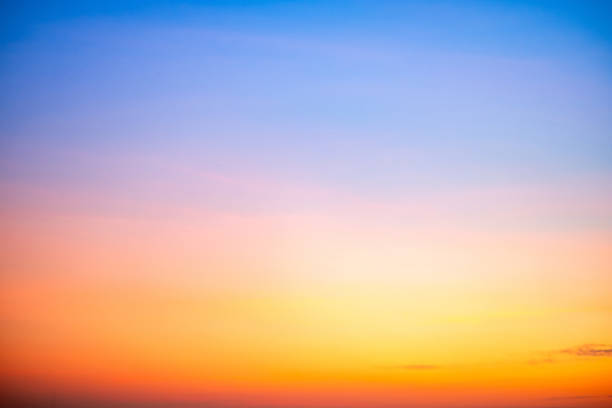 istock Sky,sunset, beautiful , luxury soft gradient orange gold clouds and sunlight on the blue sky perfect for the background, Sunrise on morning or everning in winter warm time ,Twilight summer,silhouette 2199964390