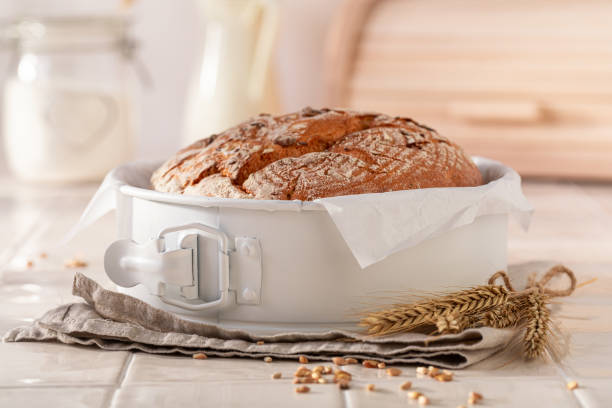 istock Healthy round loaf bread baked in a rustic bright kitchen. 2199970530