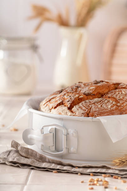 istock Fresh round loaf bread baked in home bakery. 2199970550