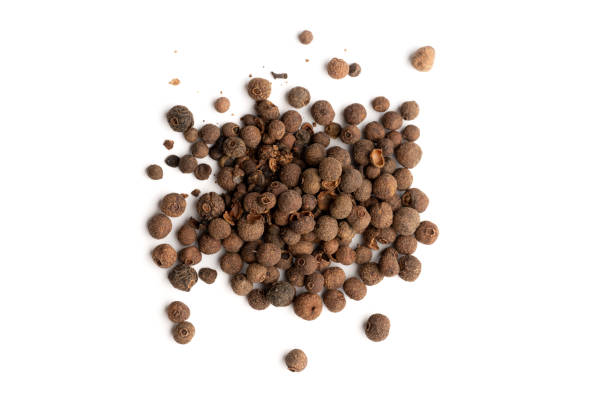 istock Pile of allspice berries on white background 2199970566