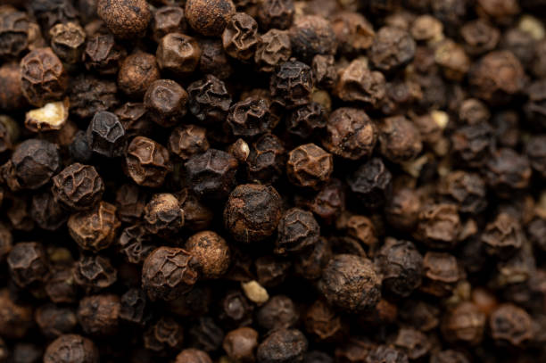 istock Close-up of black peppercorns texture 2199970655