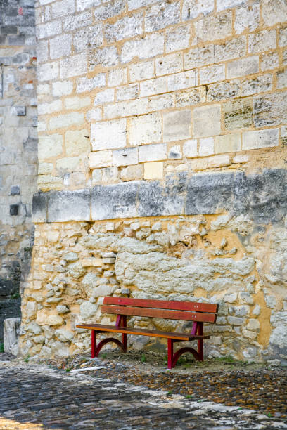 istock A red bench is sitting on a stone wall in Cognac France 2199970897