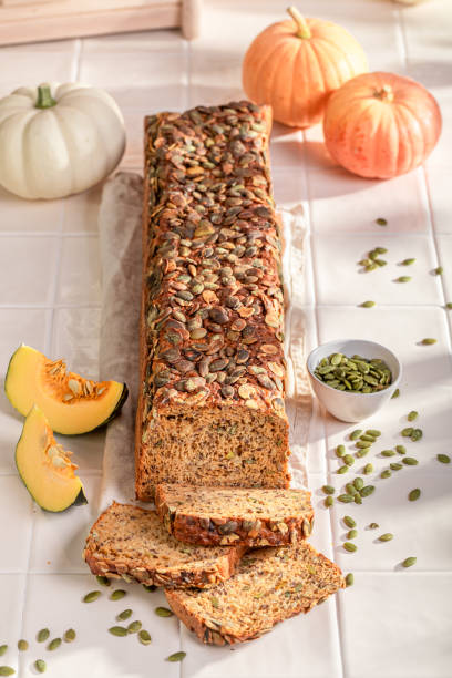istock Tasty pumpkin bread with grains and sesame seeds. 2199972034