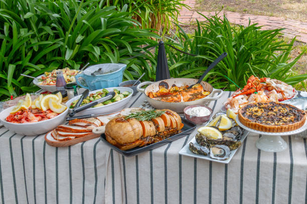 istock luxury lunch buffet on outdoor table with fish, vegetables and salad 2199973033
