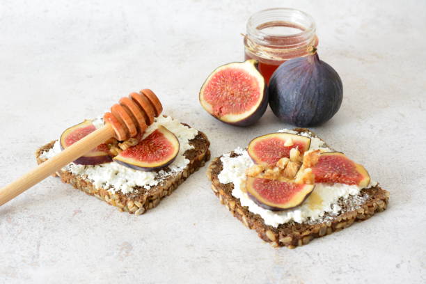 istock Fig and Honey Toast on pastel background 2199977993