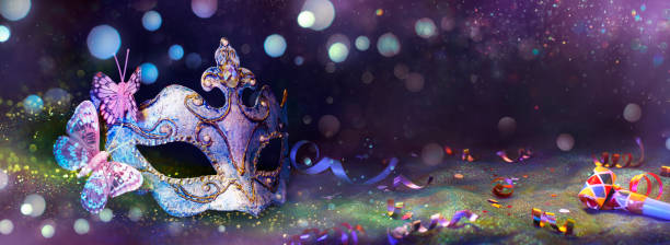 istock Carnival Party - Venetian Mask In Dark Abstract Background With Glittering And Streamers - Masquerade Disguise With Confetti And Bokeh Lights 2199983607