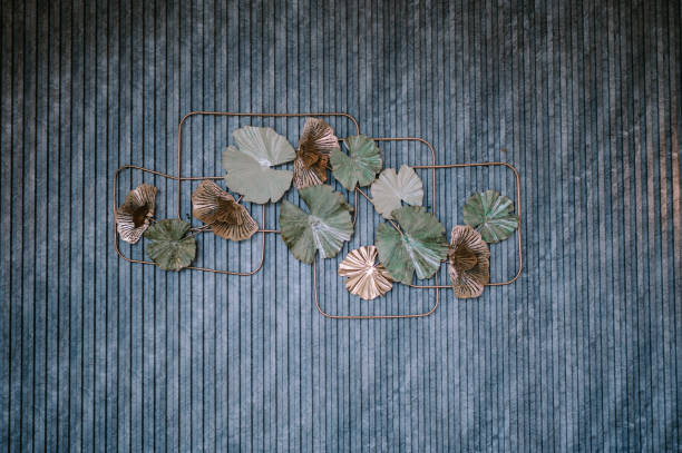 Elegant leaf decoration accentuating the textured teal wall surface
