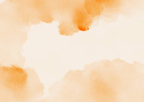 istock Soft orange watercolor background with gentle texture and subtle variations in color shades 2199987156