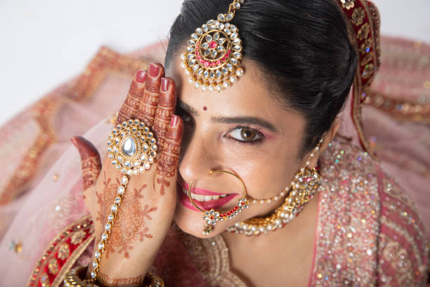 istock Close-up of beautiful bride hiding her face with hand 2199987325
