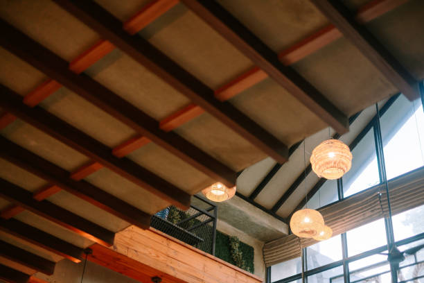 istock Intricate wooden ceiling design with woven light fixtures in modern space 2199990596