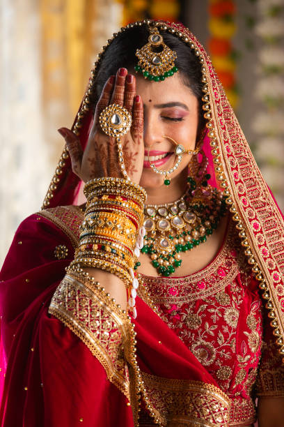 istock Shy bride with eyes closed hiding her face with hand 2199990871