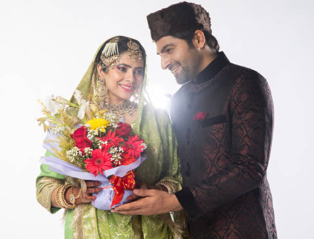 istock Romantic married couple with bouquet over white background 2199991791