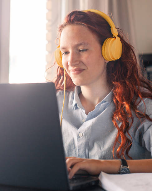 istock Millennial student sit at desk study on laptop 2199991885