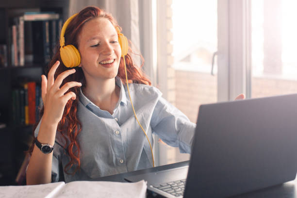 istock Millennial student sit at desk study on laptop 2199991888