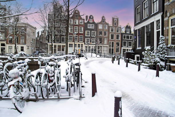 istock Snowy Amsterdam in the Netherlands at sunset 2199994151