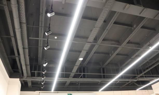 istock Modern Ceiling Design features Linear Lighting and Exposed Beams for style and utility 2199994525
