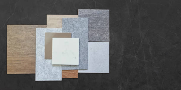 istock The image showcases a collection of various material samples arranged in a visually appealing composition, including wood tiles, stone tiles. 2199994671