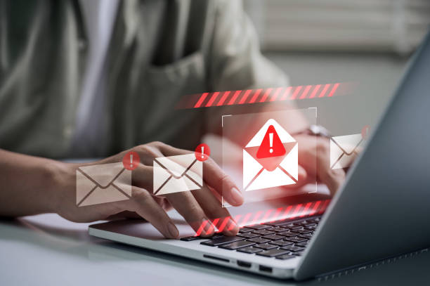 istock Spam email alert danger concept. person typing on laptop receives scam notification, illustrating cybersecurity risk and data breach threat in modern digital workspace. 2199994979