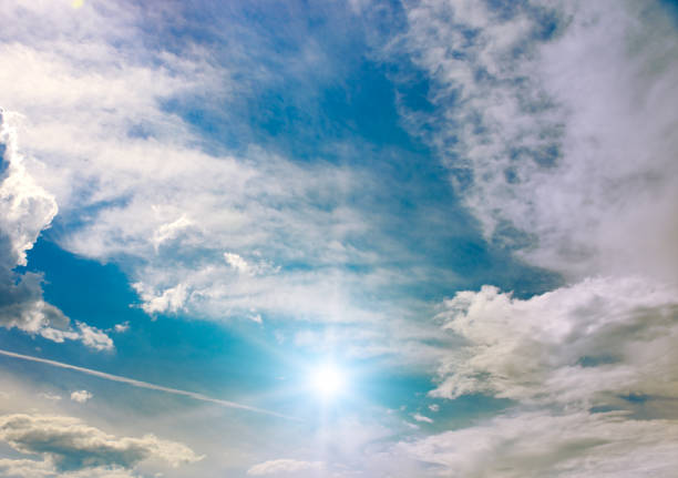 Beautiful cirrus clouds and sun against the blue sky.