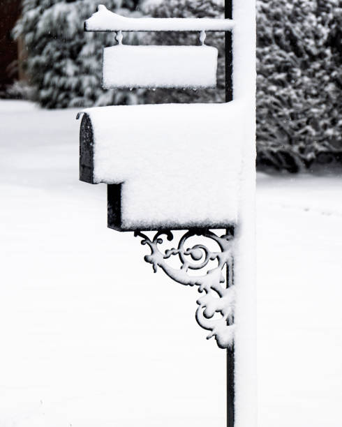 istock Residential mailbox covered with freshly fallen snow 2199996301