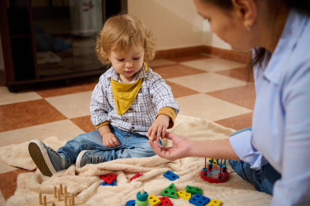istock Young Child Playing and Bonding with Mother Through Creative Toy Activities 2199996848