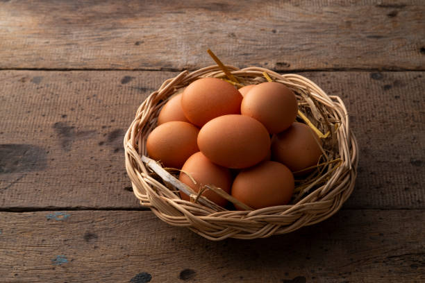istock Heap of Chicken eggs on wicker basket 2200000539