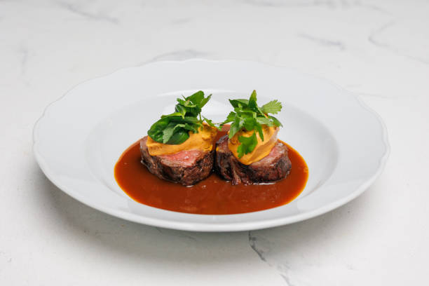 istock Veal medallions with herbs and sauce 2200003084
