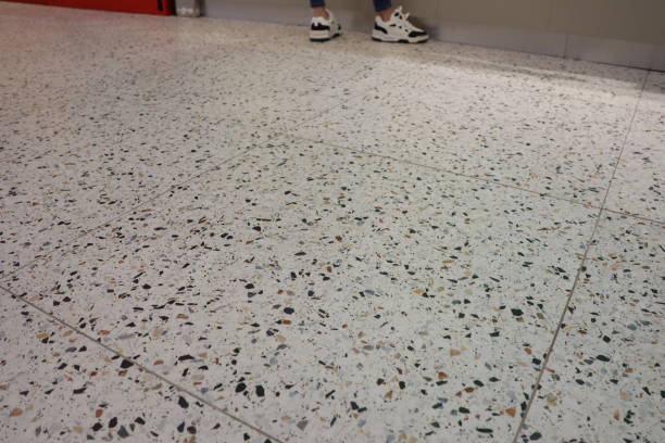 istock Exploring Patterns on a Terrazzo Floor While Wearing Stylish Sneakers for Fashion 2200004681