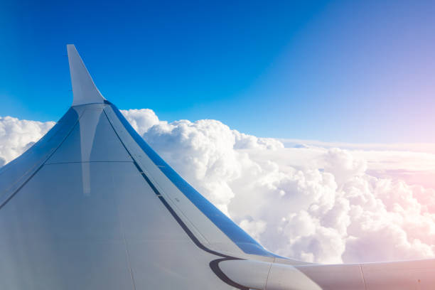 istock Capturing the beauty of clouds from an airplane wing during a clear daytime flight 2200006586