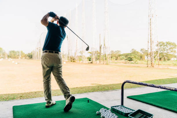 istock Senior Golfer Practicing Swing at the Driving Range for Precision and Focus 2200010151