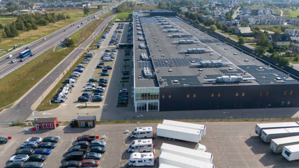istock Aerial View of Industrial Warehouse with Solar Panels 2200012421