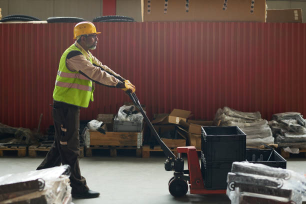 istock Male engineer pushing pallet truck 2200013229