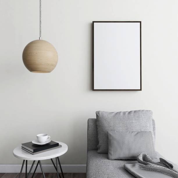 istock Vertical frame mockup with gray armchair, decorated table and lamp 2200013680